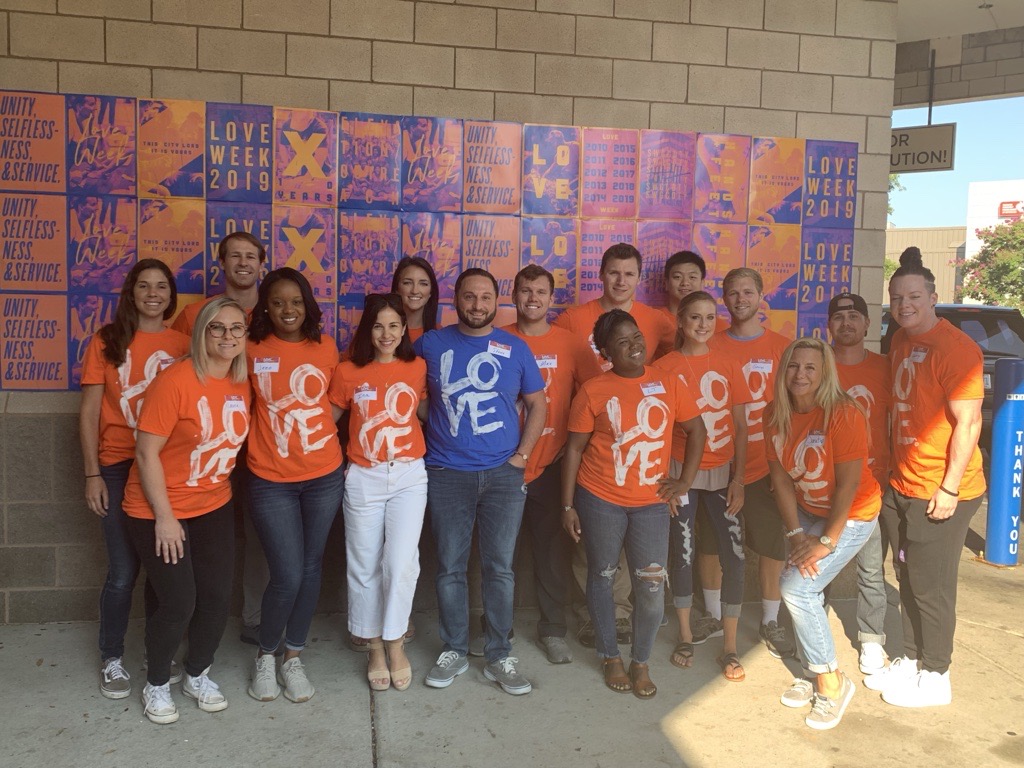 Survey team members participating in a community volunteer service event.
